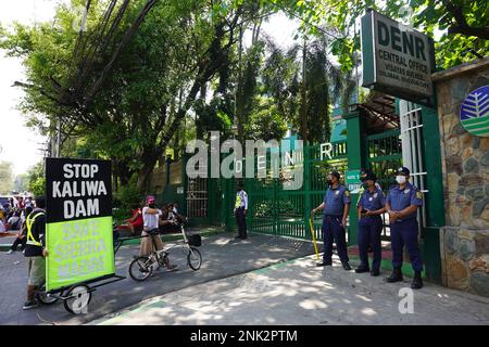 Quezon City, Philippines. 23rd February, 2023. Police baricading the Department of  Environment and Natural Resources  (DENR) in Quezon City as protesters against the construction of Kaliwa dam are arriving. Around 300 indigenous people (IP) belonging to Dumagat-Remontado tribe, together with environmental groups and advocates staged a protest outside DENR office in Quezon City. They reiterate their call against the construction of the New Centennial Water Source–Kaliwa Dam Project (NWCP-KDP), in the borders of Rizal and Quezon Province. The mega-dam project will be submerging almost hundred h Stock Photo