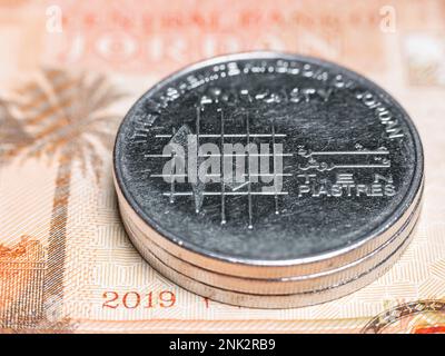 Macro detail picture with ten piastres Jordanian coin. JOD is the official currency in The Hashemite Kingdom of Jordan. Selective focus. Stock Photo