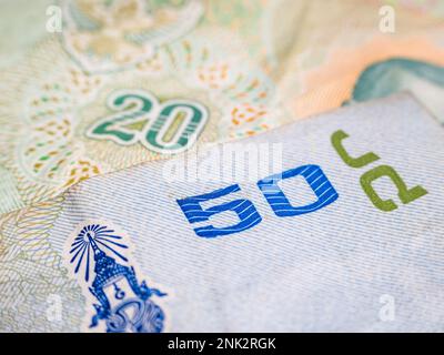 Macro detail with a 50 Thai Baht banknote. the baht is the official currency of Thailand Stock Photo