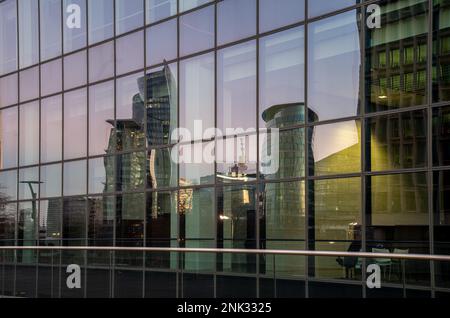 Saint Josse, Brussels Capital Region, Belgium - Feb. 08 2023 - Skyscrapers reflecting in the glass of the Finance Tower at dusk Stock Photo