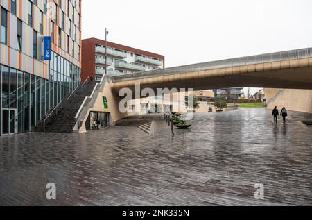 Kessel-Lo, Flemish Brabant, Belgium - Feb 11 2023 - Entrance and square of the railway station with a bridge and stairs Stock Photo