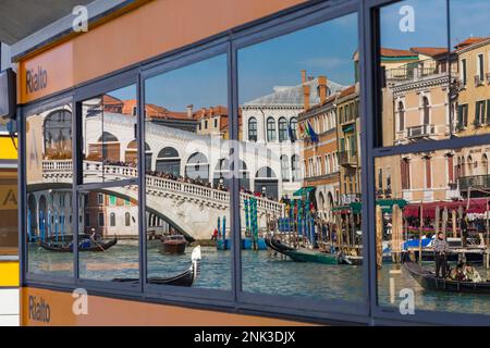 Rialto Bridge reflected in vaporetto station stop at Venice, Italy in February Stock Photo