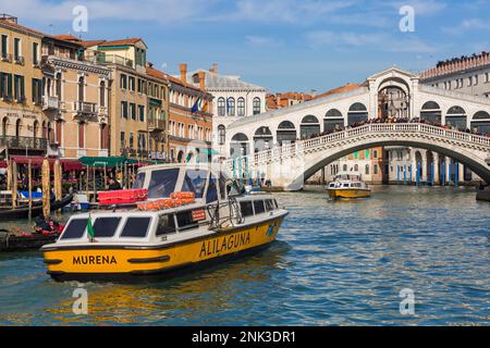 Alilaguna boats, transport  between the airport and Venice travelling along Grand Canal under Rialto Bridge at Venice, Italy in February Stock Photo