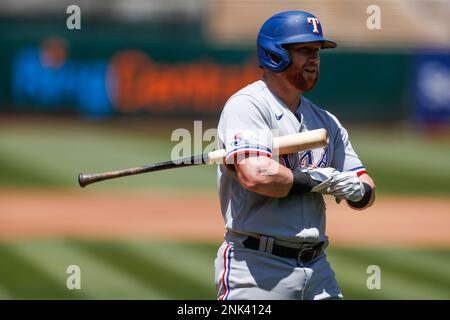 Oakland, USA. 26th May, 2022. Texas Rangers right fielder Kole Calhoun (56)  swings at a pitch during the second inning against the Oakland Athletics in  Oakland, CA Thursday May 26, 2022. (Image