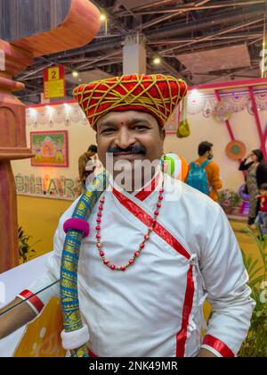 New Delhi, India - November 2022: Portrait of an male artist in traditional ethnic dress of maharashtra during the trade fair at delhi. Stock Photo