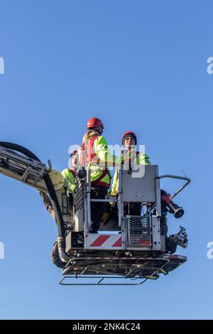 Lancashire Fire and Emergency Rescue Team on a training day at Maritime Way, Preston Docks. using a Bronto Skylift, Heavy Duty Telescopic (HDT) all-round aerial ladder platform mounted on a 2004 Red VOLVO FM Angloco Truck. The full-time Fire Crew who work 2 days on, & 2 nights on, practice and hone their skills by launching a Zodiac Rib boat and ascending the boat lift situated at Preston Docks, Riversway, UK Stock Photo