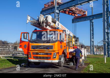 Lancashire Fire and Emergency Rescue Team on a training day at Maritime Way, Preston Docks. using a Bronto Skylift, Heavy Duty Telescopic (HDT) all-round aerial ladder platform mounted on a 2004 Red VOLVO FM Angloco Truck. The full-time Fire Crew who work 2 days on, & 2 nights on, practice and hone their skills by launching a Zodiac Rib boat and ascending the boat lift situated at Preston Docks, Riversway, UK Stock Photo