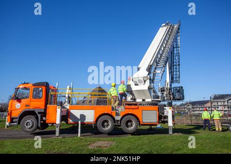 Lancashire Fire and Emergency Rescue Team on a training day at Maritime Way, Preston Docks. using a Bronto Skylift, Heavy Duty Telescopic (HDT) all-round aerial ladder platform mounted on a 2004 Red VOLVO FM Angloco Truck. The full-time Fire Crew who work 2 days on, & 2 nights on, practice and hone their skills by launching a Zodiac Rib boat and ascending the boat lift situated at Preston Docks, Riversway, UK Stock Photo