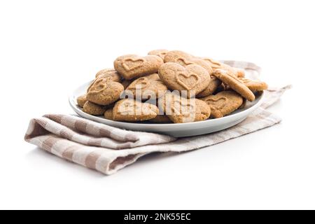 Sweet gingerbread hearts on plate isolated on the white background. Stock Photo