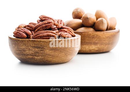 Peeled pecan nuts in bowl isolated on the white background. Stock Photo