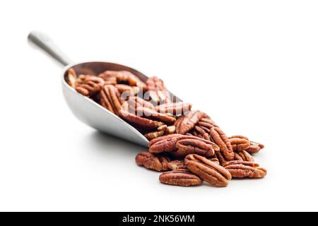 Peeled pecan nuts in scoop isolated on the white background. Stock Photo