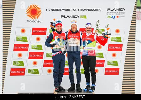 Norway's Johannes Hoesflot Klaebo, center, celebrates after winning the sprint at the 2023 FIS World Nordic Ski Championships in Planica, Slovenia, February 23, 2023. On his right, Paal Golberg (Norway), who finished second, and France's Jules Chappaz, who finished third. Credit: John Candler Lazenby/Alamy Live News Stock Photo