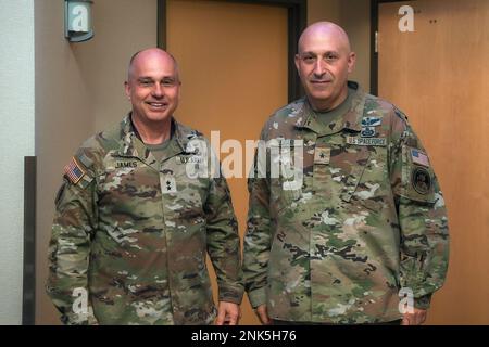 U.S. Army Maj. Gen. Tom James, left, commander of the Joint Task Force-Space Defense, and U.S. Space Force Brig. Gen. Brian D. Sidari, right, the new intelligence director of U.S. Space Command, pose for a photo at Schriever Space Force Base, Colorado, Aug. 11, 2022. During his visit to the JTF-SD, Sidari received a mission brief and was indoctrinated on the organization’s mission. The JTF-SD’s mission is, in unified action with mission partners, to deter aggression, defend capabilities and defeat adversaries throughout the continuum of conflict in order to maintain space superiority in the US Stock Photo