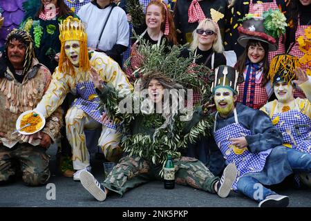 Rijeka, Croatia, 19th February, 2023. Beautiful young people group in colorful costumes smiling while posing Stock Photo