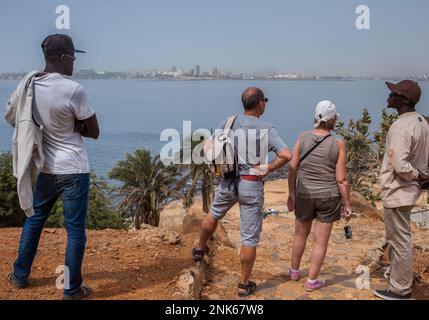 Tourist in the top of  Goree island, Dakar in background, Senegal Stock Photo