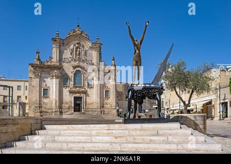 Salvador Dali sculpture in front of Church of San Francesco d’Assisi in the historic city centre of Matera, capital in Basilicata, Southern Italy Stock Photo