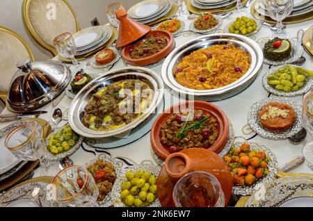 Moroccan Algerian breakfast table. Vintage background with different plates with delicious traditional middle eastern food Stock Photo