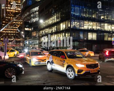 Moscow, Russia - February 15, 2023: evening traffic in Moscow City business and financial district after the end of working day Stock Photo