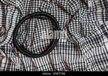 Background texture, pattern. Scarf wool like Yasser Arafat. The Palestinian keffiyeh is a gender-neutral checkered black and white scarf that is usual Stock Photo