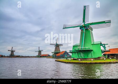 Rural landscape - view of the windmills on a cloudy winter day at the Zaanse Schan in the neighbourhood of Zaandam town, near Amsterdam, Netherlands Stock Photo