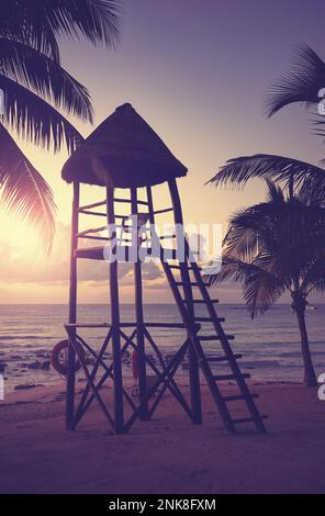 Lifeguard tower on a Caribbean beach at sunset, color toning applied. Stock Photo