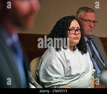 Ruth Correa listens as Eric Lindquist son of Kenneth and Janet