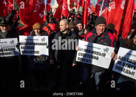 Moscow, Russia. 23rd of February, 2023. Left Front coordinator Sergei Udaltsov (C) takes part in the communist party supporters' rally in central Moscow to mark Defender of the Fatherland Day, Russia. Nikolay Vinokurov/Alamy Live News Stock Photo