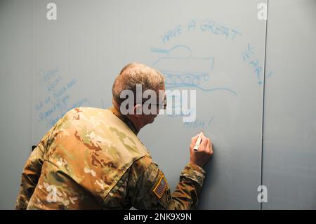 Lt. Gen. Theodore D. Martin, commanding general for the U.S. Army Combined Arms Center and Fort Leavenworth, draws a tank on a dry erase wall in the library of the new Patton Junior High School following a ribbon cutting ceremony. In November 2018, the Fort Leavenworth Board of Education began the process of replacing the original Patton Junior High School which was built in 1958. Fort Leavenworth,Ft. Leavenworth,General George Patton,Patton Junior High School, Stock Photo