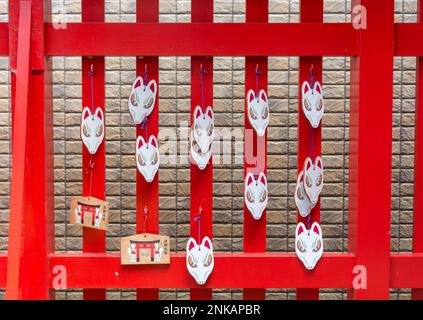 Red and white fox masks and ema prayer plaques at Asanogawa inari jinja ...