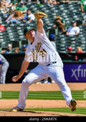 Oakland Athletics relief pitcher Zach Jackson celebrates after