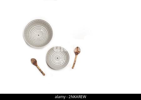 Two white and black ceramic bowls on a white background with copy space in a top view Stock Photo