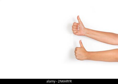 Woman hands with thumb up on a white background with copy space Stock Photo