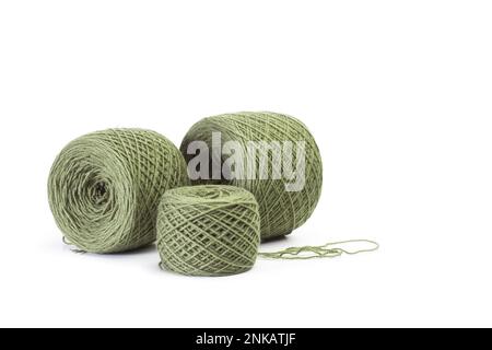 Green wool balls on a white background with copy space Stock Photo