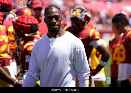 Former Washington Redskins player, Richard Doc Walker, greets Redskins'  quarterback Robert Griffin III before their game against the Tennessee  Titans at FedEx Field in Landover, Maryland on October 19, 2014. UPI/Pete  Marovich