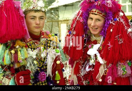 Traditional carolers with heavy decorated costumes in Suceava county Romania, approx. 2000. Stock Photo