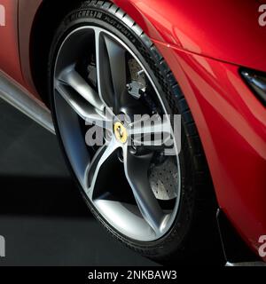 The front wheel of a red Ferrari 296 GTB. Tire Michelin Pilot Sport 4 S. Katowice, Poland, 17.10.2022 Stock Photo