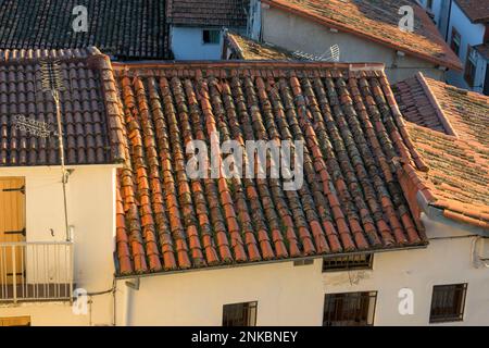 Old roof with broken red tiles in need of repair to avoid horizontal leaks Stock Photo