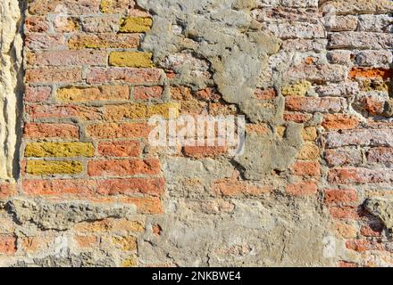 Old brick wall with red brick background, Concrete crack, vintage wall background. Stock Photo