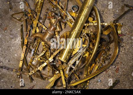 Old brass elements plumbing in recycling. Recycling of non-ferrous scrap Stock Photo