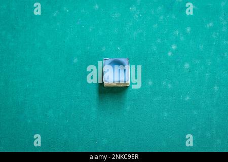 A snooker chalk on a pool table Stock Photo