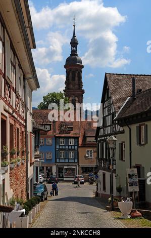 Old half-timbered houses in the Egelgasse with a view of the St. Marien parish church, Gengenbach, Baden-Wuerttemberg, Germany Stock Photo