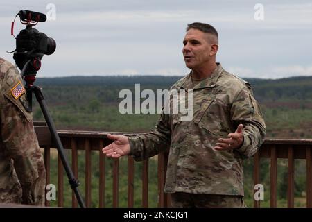 U.S. Army Chief Warrant Officer 5 Patrick Nelligan, command chief warrant officer, U.S. Army Reserve Command, conducts an interview about the importance of realistic multi-domain operations involving cross components of the National Guar, Reserves and active Army, Aug. 13, 2022 during Northern Strike at the Camp Grayling Joint Maneuver Training Center in Grayling, Mich. Northern Strike is designated to challenge over 7,400 service members with multiple forms of training that advances interoperability across multicomponent, multinational and interagency partners. Stock Photo