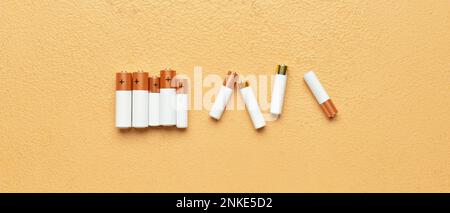 Alkaline batteries on color background Stock Photo