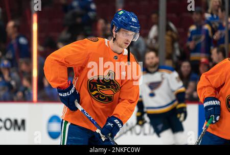 Vancouver Canucks' Elias Pettersson wears a pride-themed warmup jersey  before the team's NHL hockey game against the Calgary Flames on Friday,  March 31, 2023, in Vancouver, British Columbia. (Darryl Dyck/The Canadian  Press