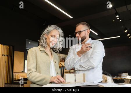 Two colleagues working on project in architect's office together Stock Photo