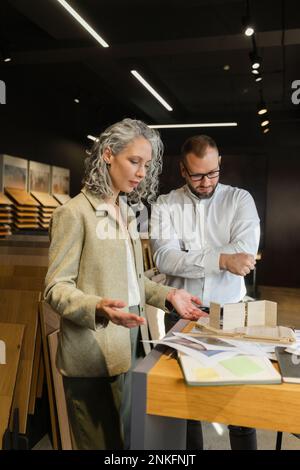 Two colleagues working on project in architect's office together Stock Photo