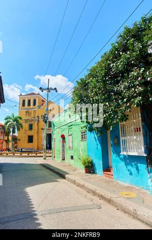 Colorful houses by street under blue sky, Cartagena de Indias, Colombia Stock Photo