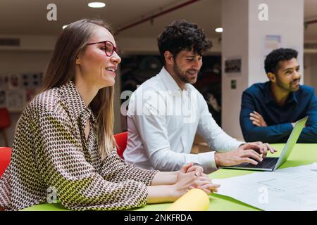 Smiling business colleagues having a meeting in office Stock Photo