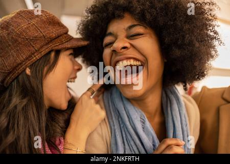 Cheerful multiracial friends laughing and enjoying Stock Photo