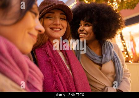 Smiling multiracial friends enjoying together Stock Photo